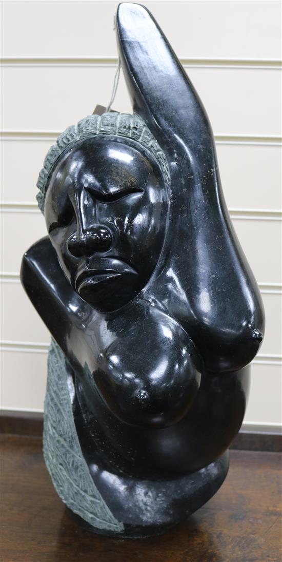 A Zimbabwean polished and textured stone sculpture of a woman